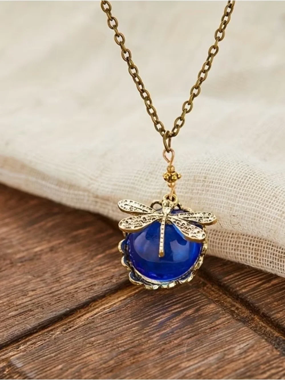 Gold Dragonfly Pendant Necklace with Deep Blue Cabochon On An 18